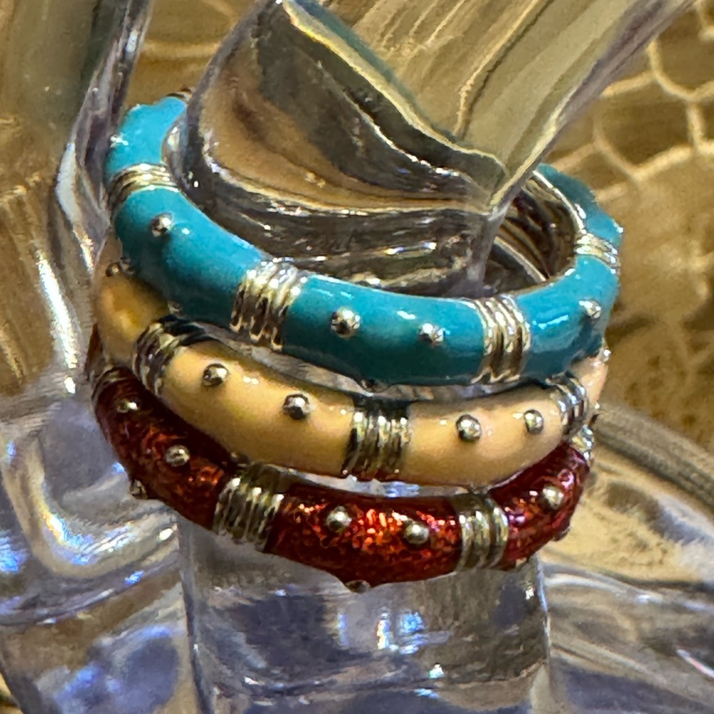 Stack of enameled silver studded rings